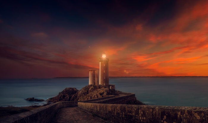 4K Sunset Lighthouse on Rocky Coast