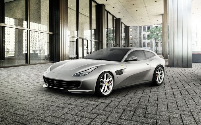Silver Ferrari GTC4Lusso T parked on cobblestone