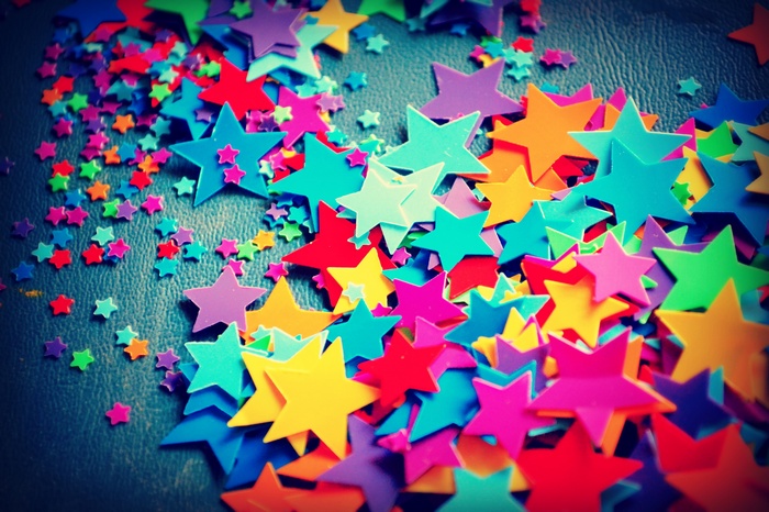 Scattered colorful star confetti