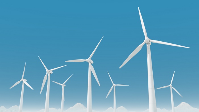 Wind turbines in a clear blue sky with mountains