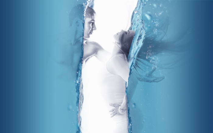 Couple underwater with blue water effect