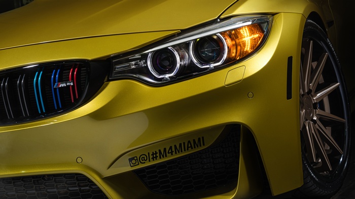 Yellow BMW M4 with Miami decal