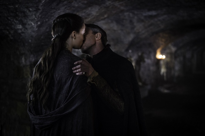 Couple kissing in a dark tunnel