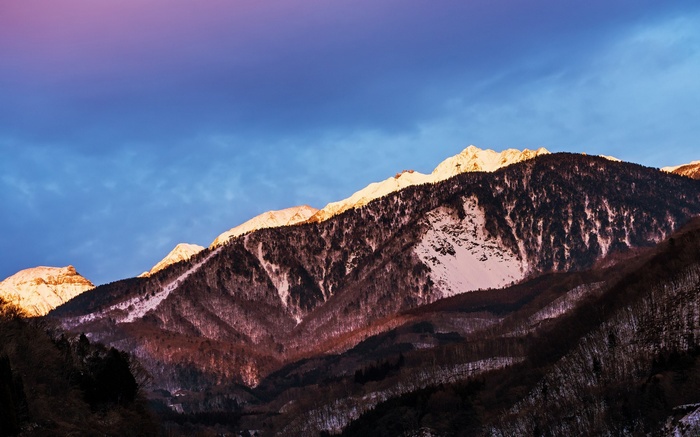 Snow-capped mountains at sunrise
