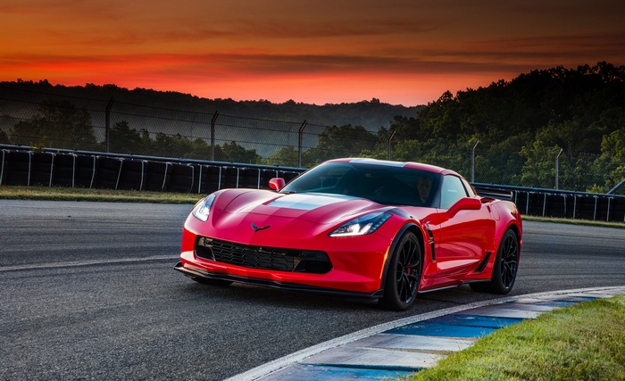Red Chevrolet Corvette Grand Sport on a Racetrack