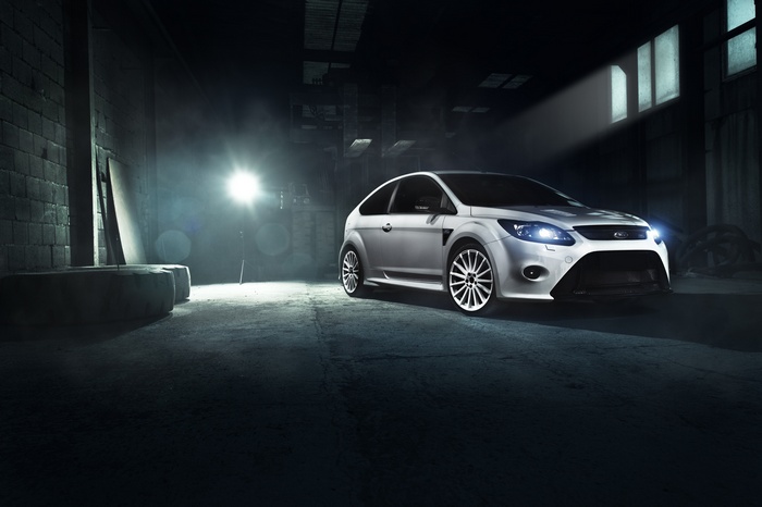 White Ford Focus RS in a dark garage