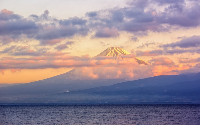 Mount Fuji at sunset over the ocean