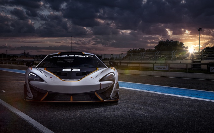 McLaren 650S GT3 race car on track at sunset