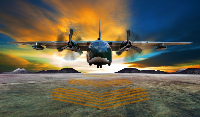 Lockheed C-130 Hercules landing at sunset