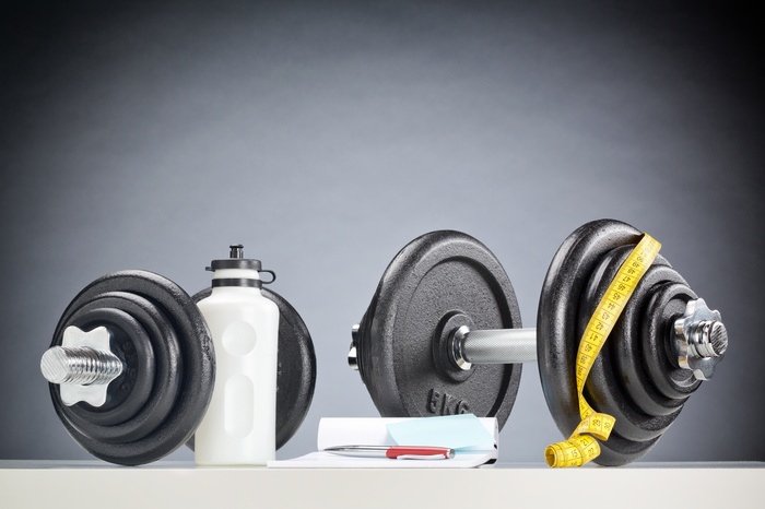 Dumbbells, Water Bottle, and Measuring Tape for Fitness