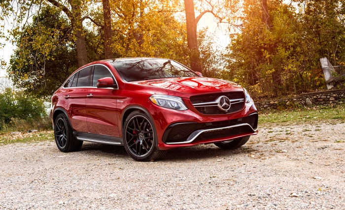 Red Mercedes-AMG GLE63 S Coupe in a Forest