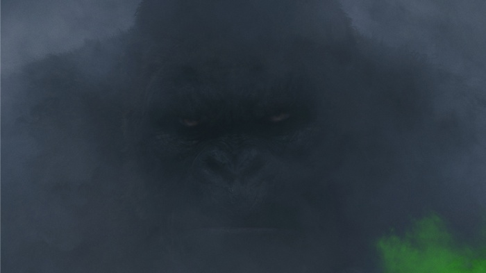 Giant gorilla emerging from smoke