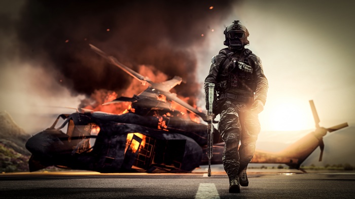 Soldier walks past a burning helicopter in Battlefield 4