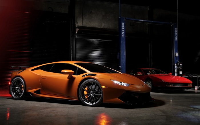 Orange Lamborghini Huracan and red Ferrari Testarossa
