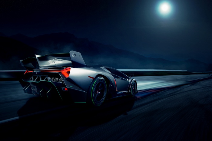Lamborghini Veneno driving on a road at night