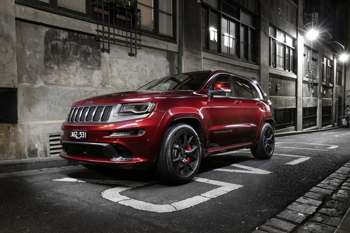 Red Jeep Grand Cherokee SRT Night parked on street