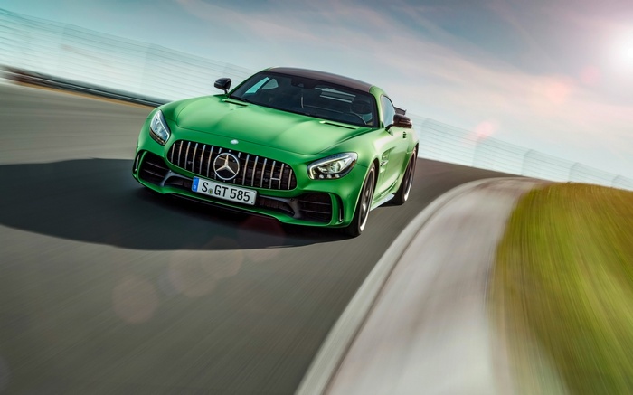 Green Mercedes-AMG GT R driving on a race track