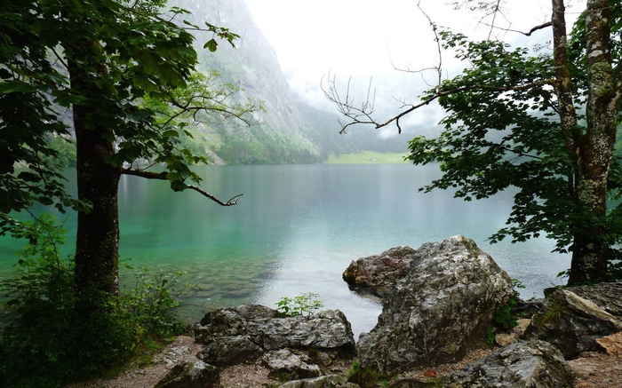 Lake surrounded by mountains and trees