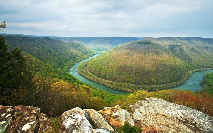 River winding through forested mountains