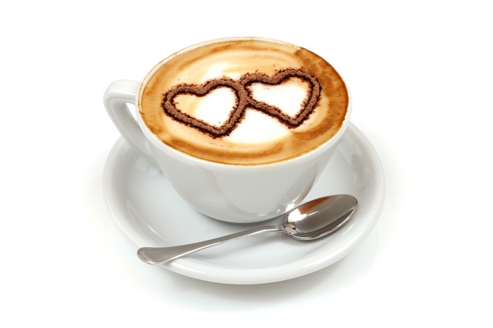 Coffee cup with heart art and spoon