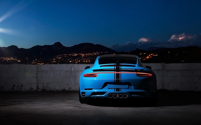 Blue Porsche 911 Coupe with Black Stripes at Night