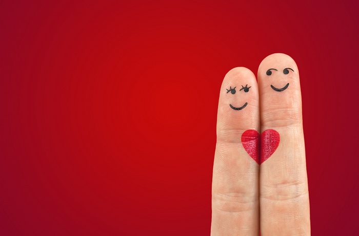 Couple fingers with heart on red background 4K
