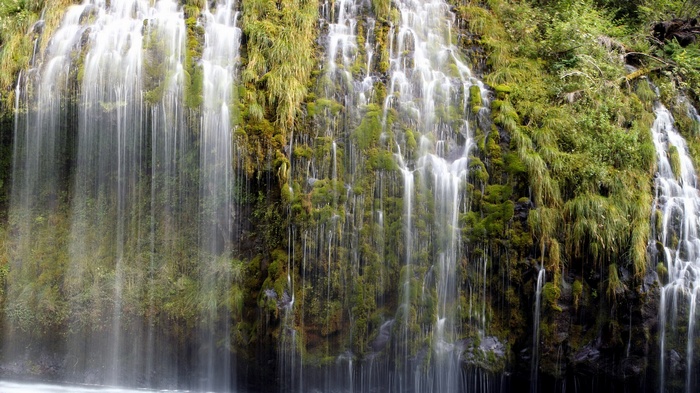 Mossy rocks with water cascading down
