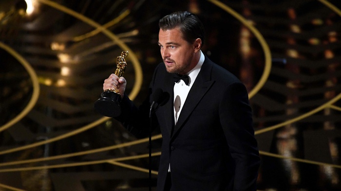 Leonardo DiCaprio holding an Academy Award