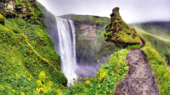 Skogafoss Waterfall in Iceland with a walking path