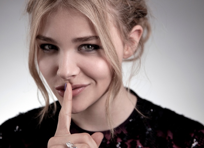 Chloe Moretz with finger on lips
