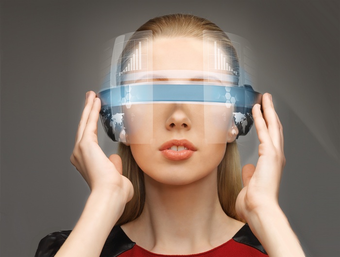 Woman wearing VR headset with futuristic interface