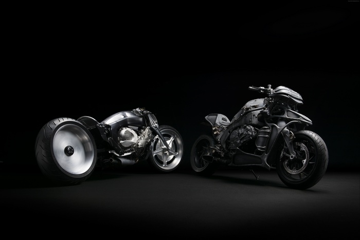 Two custom BMW motorcycles on a black background