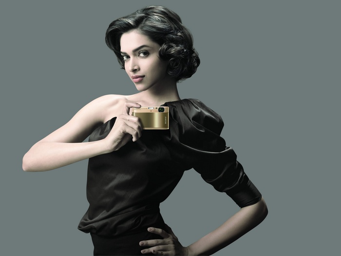 Deepika Padukone Posing with Gold Sony Cybershot Camera