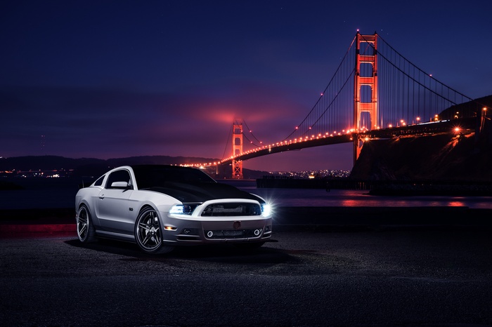 Ford Mustang in front of Golden Gate Bridge at Night