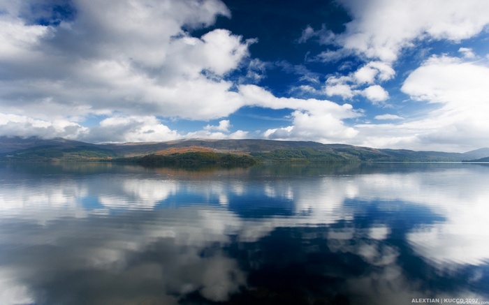 Lake and Mountains Under a Cloudy Sky