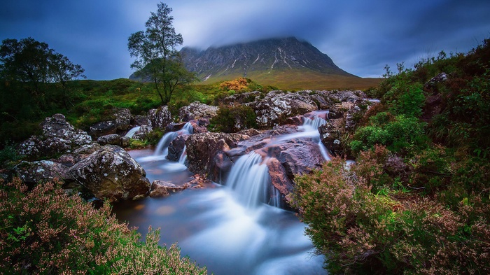 Mountain landscape with a waterfall and trees
