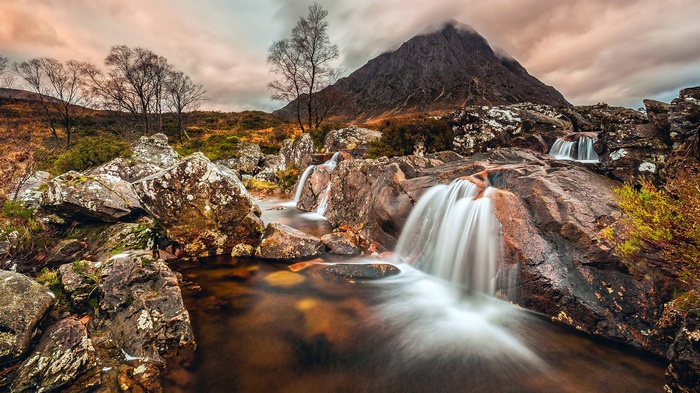 Mountain landscape with waterfalls and rocky terrain