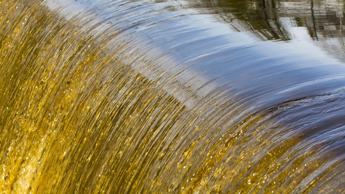 Water flowing over a weir