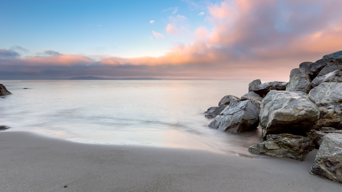 Long exposure of a rocky beach at sunset