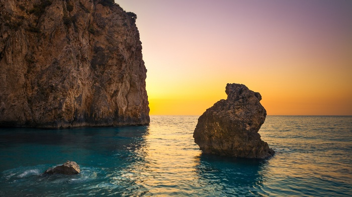 Rocky coast and sea at sunset
