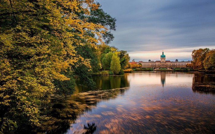 Palace reflected in a lake during autumn