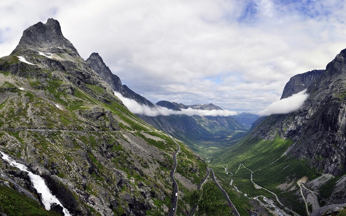 Winding mountain road through a valley in Norway