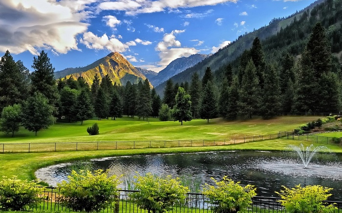 Mountain landscape with a pond and fountain