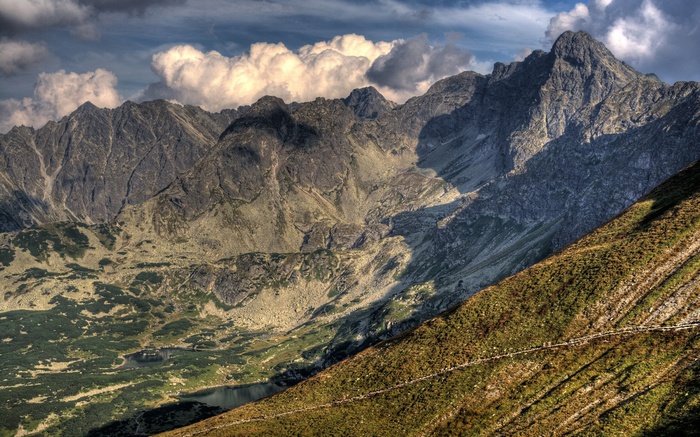 Mountain range with clouds and a lake