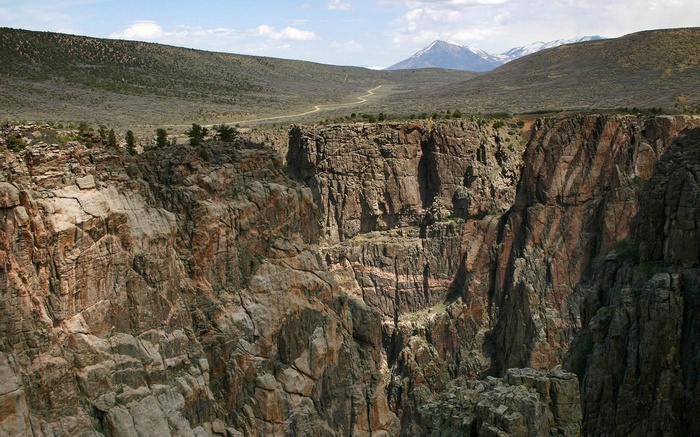 Canyon with mountains and winding road