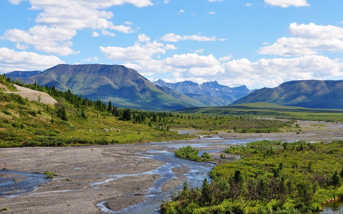 Mountain range with river and green hills