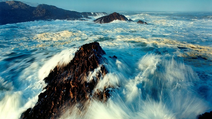 Waves crashing against rocky shore