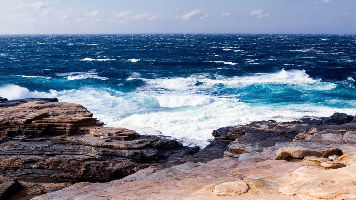 Waves crashing on rocky shore