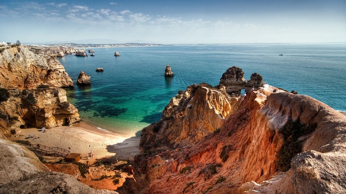 Rocky coastline with a beach and turquoise water