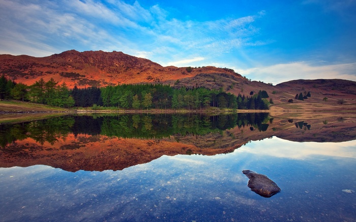 Mountain lake reflection at sunset